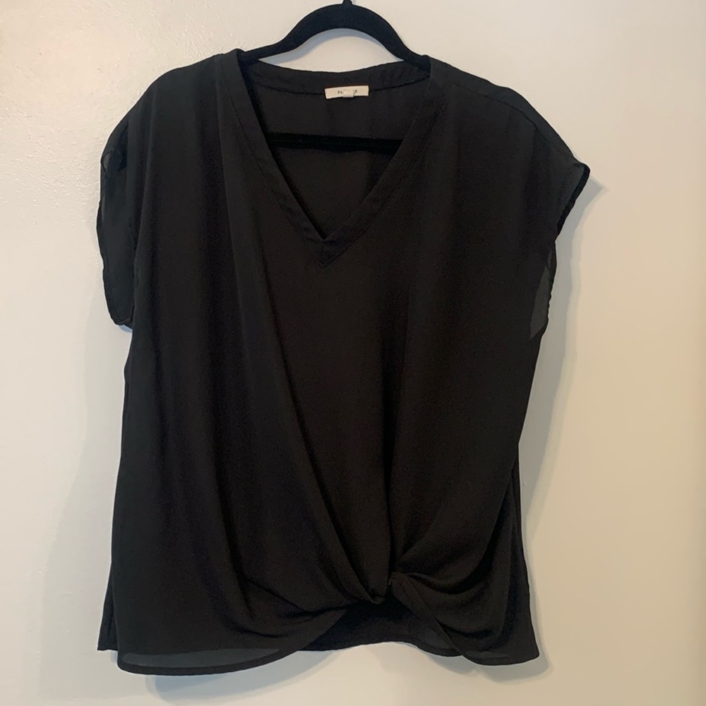 Sleeveless blouse, not too sheer, with twist knot